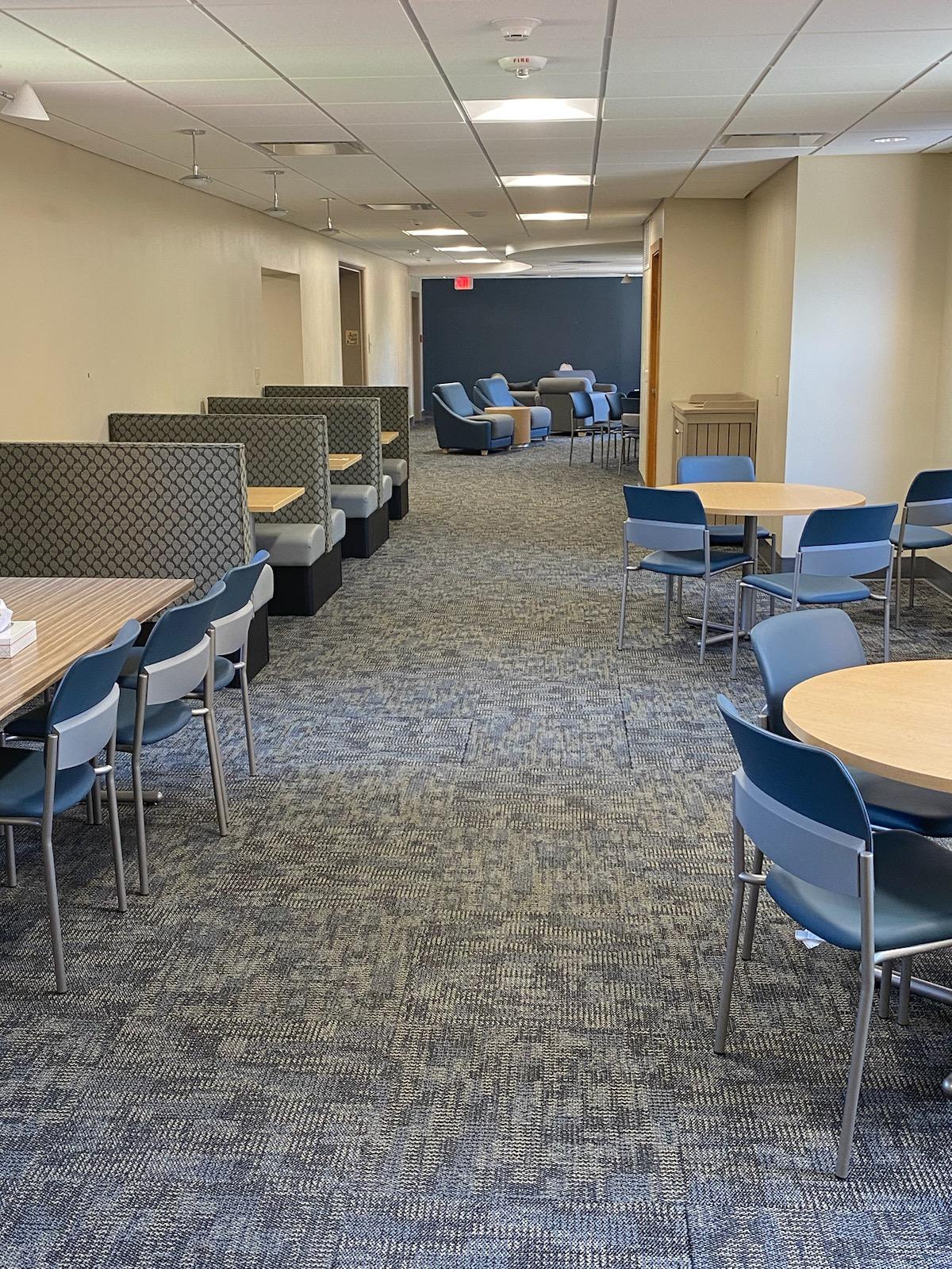 Student lounge with tables and comfortable chairs