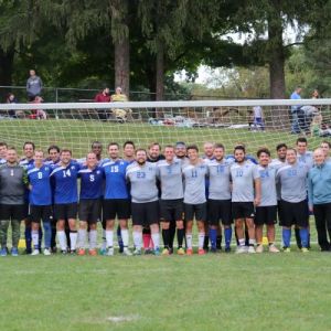 Soccer teams posed in front of goal