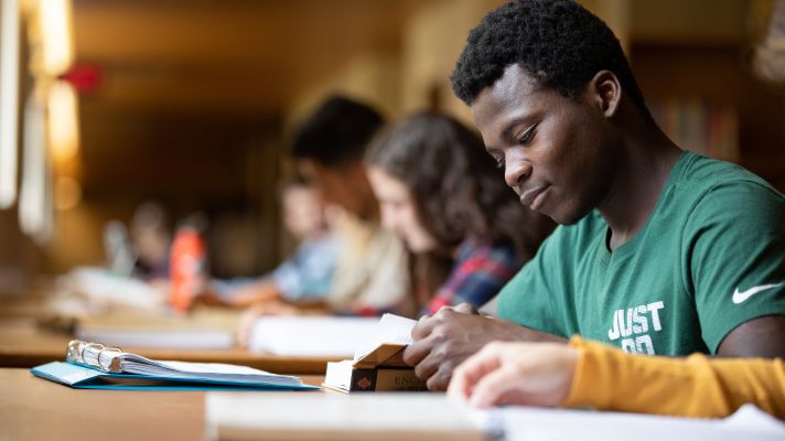 Emmaus student studying in the library