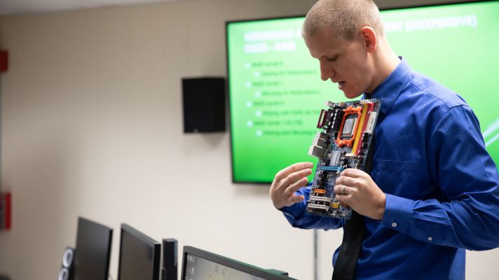 Emmaus professor, Stephen Eliot, teaching a computer studies course