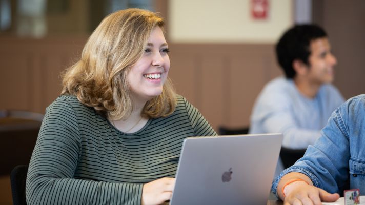 Emmaus student studying on her laptop